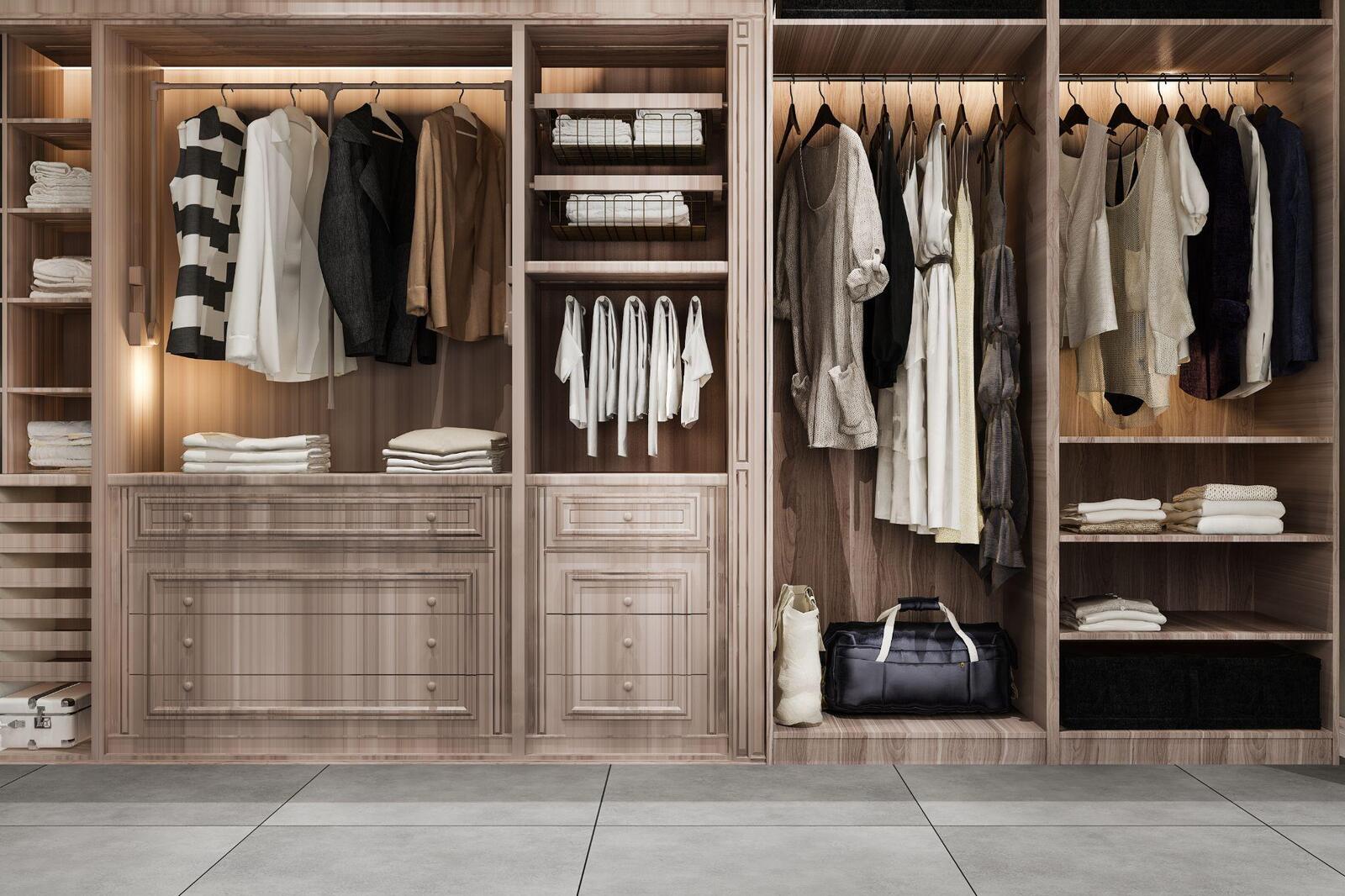 Custom closet system with double hanging rods, pull-out drawers, open shelving and a long hanging section for dresses and coats
