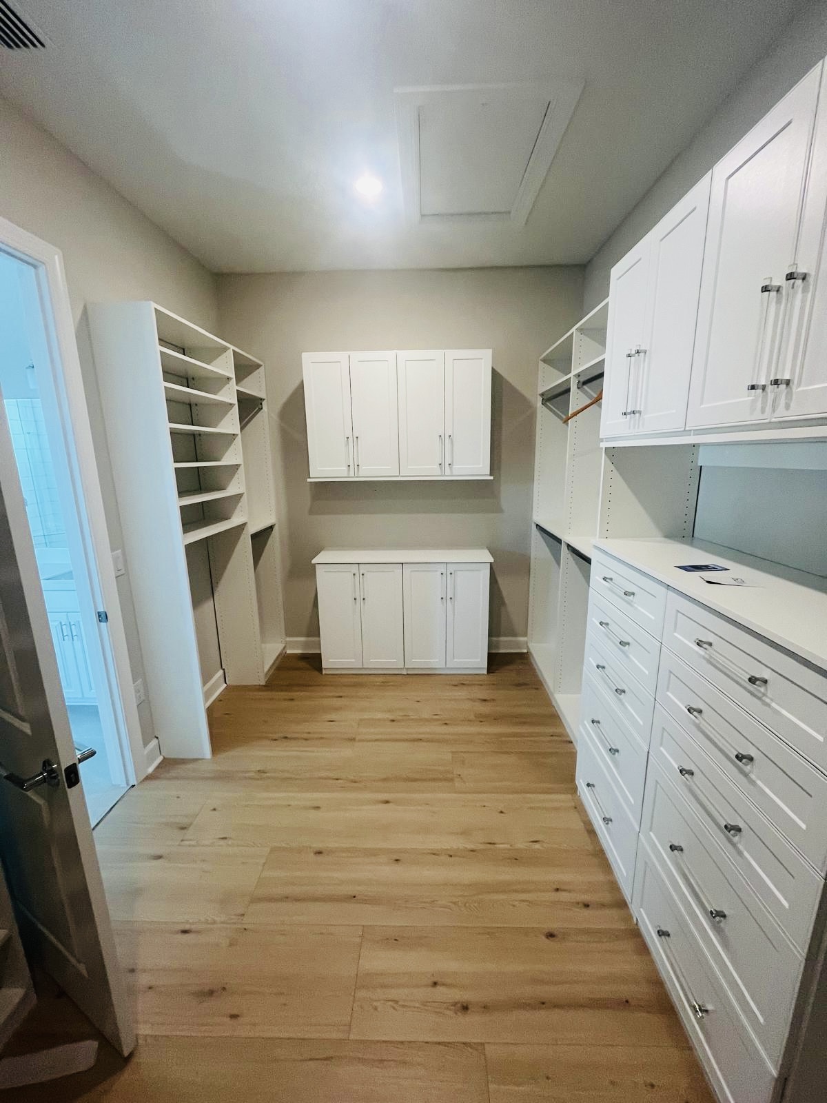 Custom closet storage solution with floor-to-ceiling cabinetry in Lakewood Ranch FL by Dream Closets LLC