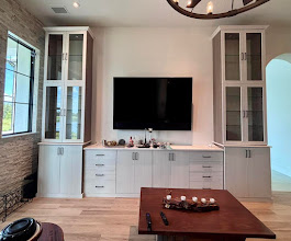Entertainment wall unit with glass-front display cabinets