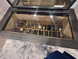 Glass-top watch display drawer in custom closet island